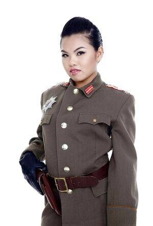 Oriental pornstar Cindy Starfall posing solo in military garb on nudesceleb.com