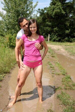 Brunette teen and her boyfriend fuck in the middle of a dirt road in the woods on nudesceleb.com