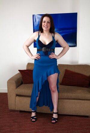 Chubby mature Jenna Brooke is showing her body in a blue dress on nudesceleb.com