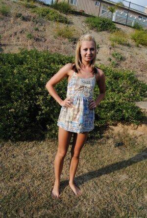 Blond amateur Tiny Tiff removes a summer dress and thong to stand nude outside on nudesceleb.com
