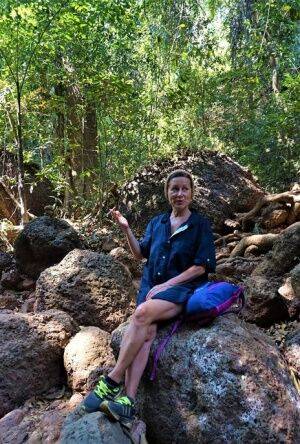 Mature amateur Diana Ananta sports a no panty upskirt while hiking in a forest on nudesceleb.com