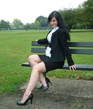 Fully clothed model Nicola takes a walk on park pathway in her new black pumps on nudesceleb.com