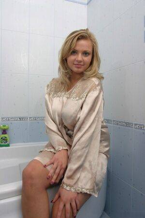Big titted female Malina May plays with her dildo while taking a bath on nudesceleb.com