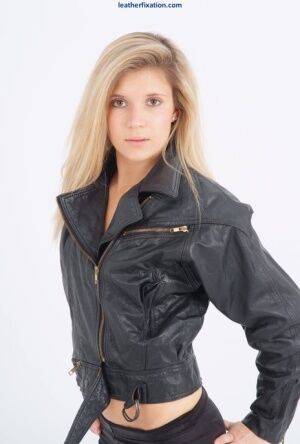 Blond chick unzips her leather jacket in a black bra and leggings on nudesceleb.com