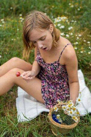 First timer Oxana Chic toys her pussy in a field while wearing sandals on nudesceleb.com