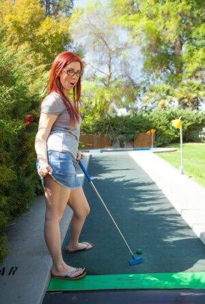 Hot redhead in glasses spreads her legs for a no hot panty upskirt outdoors on nudesceleb.com