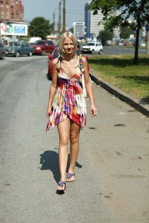 Charming teen blonde posing solo in a lovesome dress outdoor on nudesceleb.com