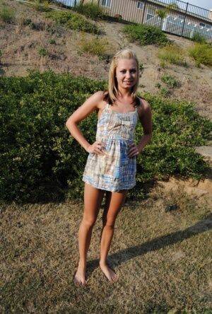 Blonde amateur Tiff stands naked in a yard while showing her cute butt on nudesceleb.com