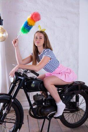 Adorable teen Milka gets totally naked in front of a vintage motorcycle on nudesceleb.com