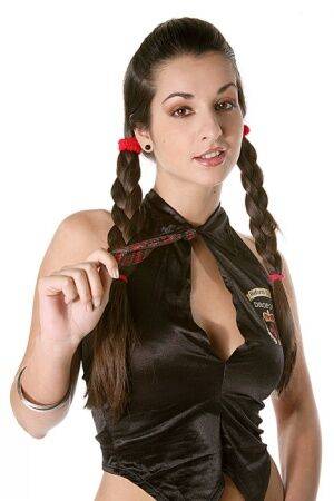 Hot brunette in braided pigtails does a sensual striptease on nudesceleb.com