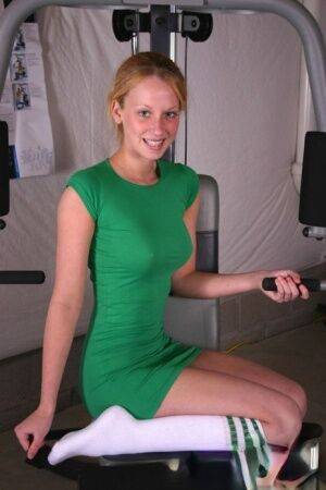 Teen solo girl models non nude in a tight dress and sport socks at the gym on nudesceleb.com