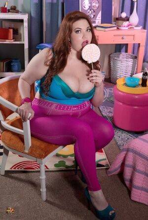 Super sexy fatty Nixie Night lick a lollipop while exposing great big boobs on nudesceleb.com