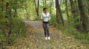 Female jogger Gabriellla Gucci pulls down her leggings for a pee in the woods on nudesceleb.com