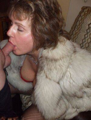First timer Busty Bliss gives a POV blowjob in a fur coat and mesh hosiery on nudesceleb.com