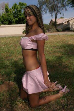 Luscious babe Rio looks stunning posing in her pink outfit in public on nudesceleb.com