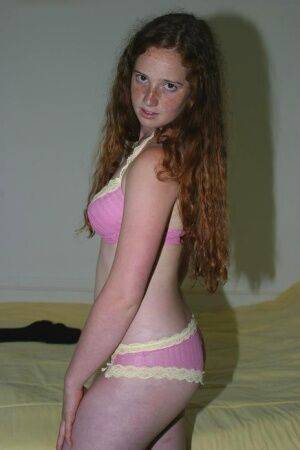 Flexible redhead Rachel showcases her natural pussy after lingerie removal on nudesceleb.com