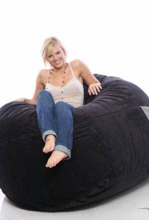 Blonde amateur models non nude on a bean bag chair in blue jeans on nudesceleb.com