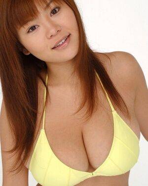 Pretty Japanese redhead Yoko Matsugane models a yellow bikini in bare feet - Japan on nudesceleb.com