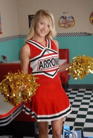 Cute blonde Tegan Summers models non nude in her cheerleader uniform on nudesceleb.com