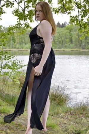 Redheaded amateur Luscious Models models lingerie while in a lake on nudesceleb.com