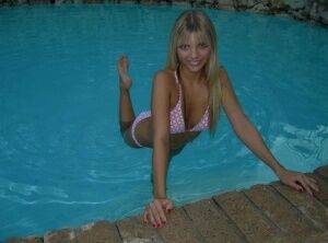 Blonde amateur Jana Jordan models a bikini while in an indoor swimming pool - Jordan on nudesceleb.com