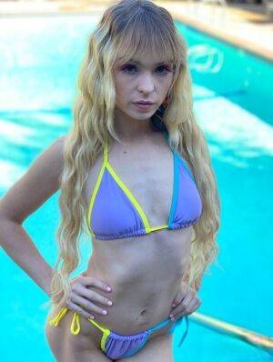 Blonde teen with long hair Lilly Bell models a bikini before a BJ and a facial on nudesceleb.com