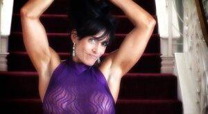 Female bodybuilder Elise Penn models non nude in a sheer sleeveless dress on nudesceleb.com