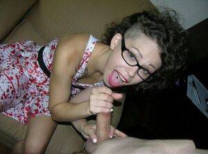 Cute young girl Bailey Paige sucks the cum from a cock while wearing glasses on nudesceleb.com