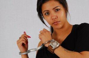 Amateur girl Destiny models a huge OOZOO watch while handcuffed on nudesceleb.com