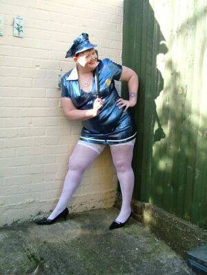 Mature plumper Valgasmic Exposed models latex police attire in white stockings on nudesceleb.com