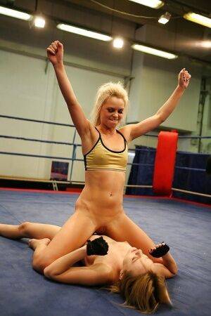 Pretty lesbians gasping and stripping each other in the wrestling ring on nudesceleb.com