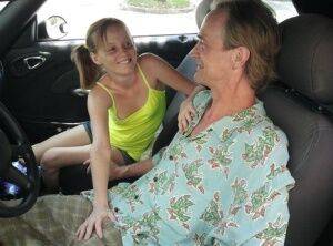 Tiny teen cutie Alyssa Hart in pigtails giving a hot handjob in the car on nudesceleb.com