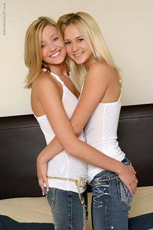 18 year old blonde girls doff tank tops and jeans for lesbian sex on nudesceleb.com