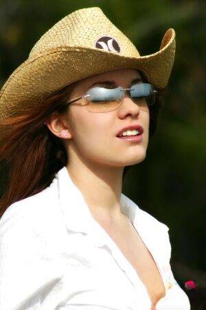 Farm girl in shades and a straw hat unbuttons her shorts and opens her shirt on nudesceleb.com