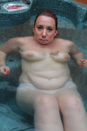 Chubby middle-aged woman Sara Banks relaxes in a hot tub while totally naked on nudesceleb.com