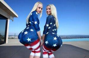 Three stunning babes supporting troops by posing in sexy bodypainting on nudesceleb.com