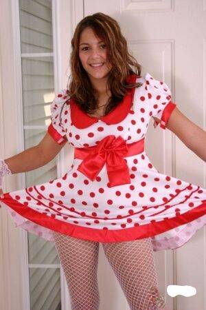 Cute teen Kara exposes white underwear in fishnets and a polka-dot dress on nudesceleb.com