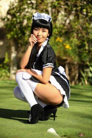 Japanese maid Marica Hase exposes her tits and twat on a putting green - Japan on nudesceleb.com