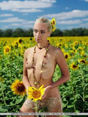 Amidst a large field of sunflowers in full bloom, Adele&39s natural beauty is on nudesceleb.com