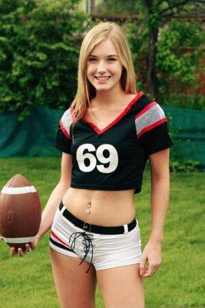 Beautiful blonde Jewel doffs sportswear to pose nude while holding a football on nudesceleb.com