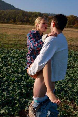 Blonde girl and her boyfriend have sex in a crop field away from prying eyes on nudesceleb.com