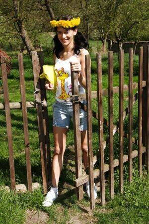 Sweet brunette teen Amanda undressing her clothes outdoors on nudesceleb.com