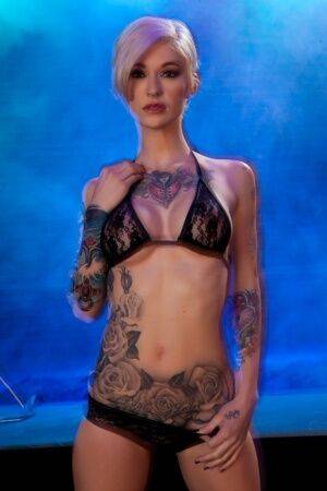 Hot tattooed Kleio Valentien sheds black lace panties to squat & spread legs on nudesceleb.com