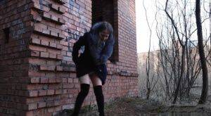 Distressed girl Nastya pulls down her tights to pee by an abandoned building on nudesceleb.com