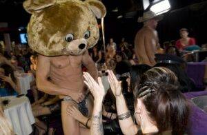 Clothed chicks please a dancing bear on a non nude wild party on nudesceleb.com