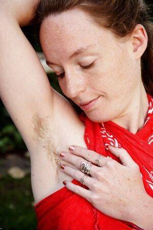 Barefoot redhead Ana Molly displaying hairy underarms and vagina outside on nudesceleb.com