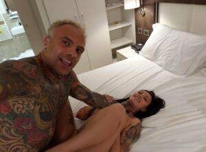 Tattooed couple engage in rough sex on top of their bed in self shot action on nudesceleb.com