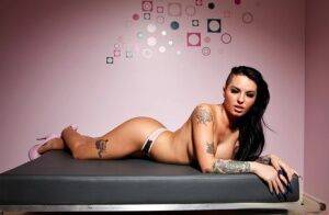 Tattooed female Christy Mack exposes her big tits and sexy as in heels on nudesceleb.com