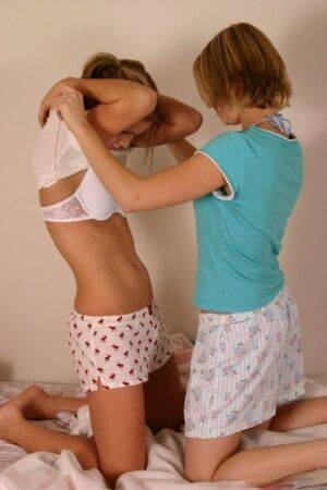 Young amateur Karen & Amy enjoy undressing each other & kissing in underwear on nudesceleb.com