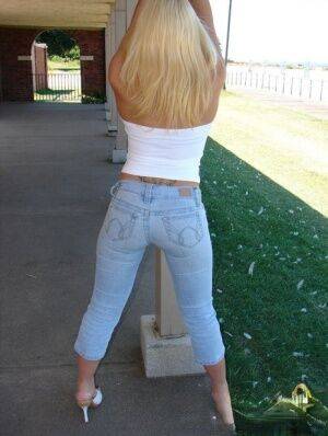 Blonde amateur Karen exposes her lace thong while outdoors in faded jeans on nudesceleb.com